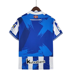 Camisa Real Sociedad I 22/23 Macron - Branco e Azul